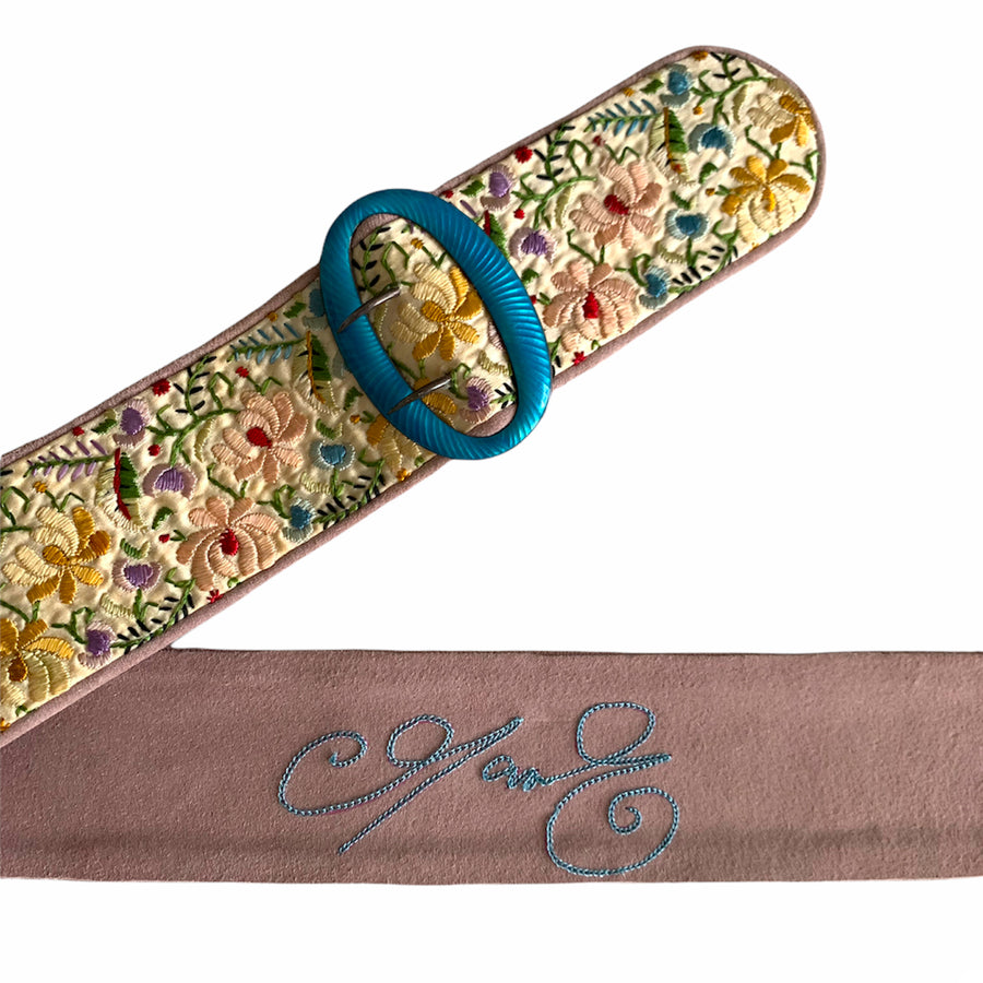 The belts are made by the Queen's belt maker Carol Craves-Johnson from Cingular in Stockwell who has a charming workroom where the magic happens, here we create one of a kind belts.  This waisted belt and has an early Victorian turquoise cabochon oval buckle with antique oval flower embroidered windows on a pink suede belt strap 