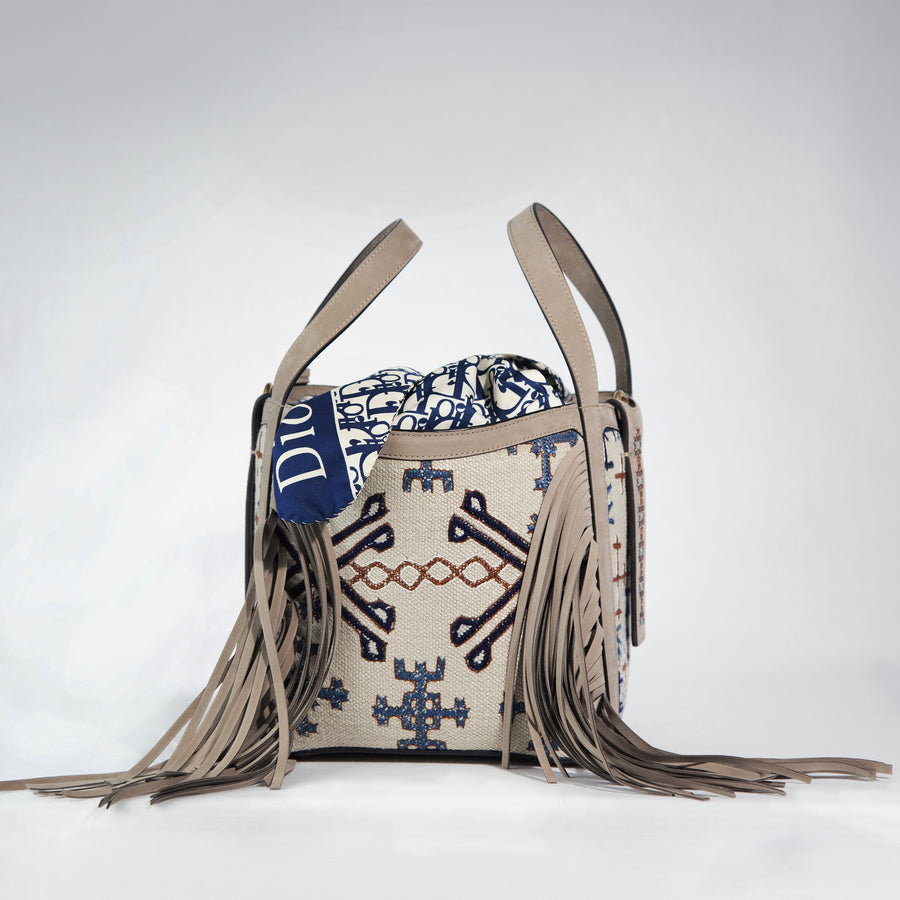Demetria has created a limited collection of 50 handbags, which are unique pieces. Adorned with exceptional work from the T’boli, Mangyan and Tausug people, who hail from the southernmost edge of the Philippines, each piece is a complete expression of two different creative paths, European luxury and exceptional traditional skill.  A classic shape made out of embroidered calfskin with detachable shoulder and cross-body straps. The bag comes with a silk vintage scarf. 