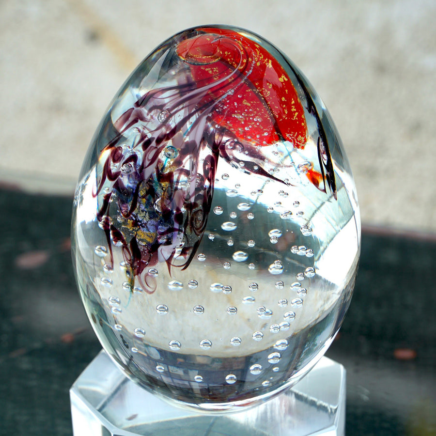 Transparent and red Glass Egg is a hand sculpted unique piece with Murano Glass using the “Perle Sommerso” technique