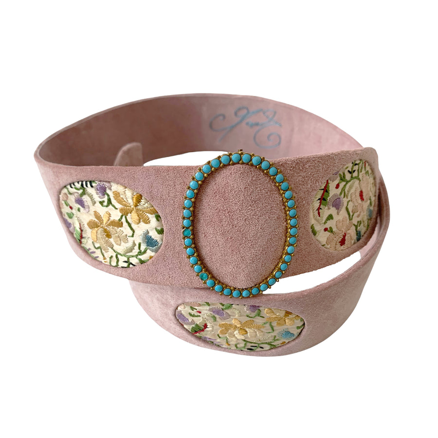 The belts are made by the Queen's belt maker Carol Craves-Johnson from Cingular in Stockwell who has a charming workroom where the magic happens, here we create one of a kind belts.  This waisted belt has an early Edwardian turquise etched enamel oval buckle with antique silk satin stitch Chinese embroidery, piped with pink suede