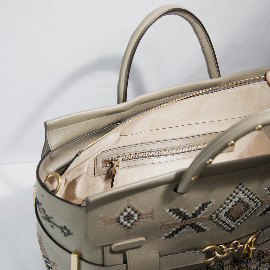 Demetria has created a limited collection of 50 handbags, which are unique pieces. Adorned with exceptional work from the T’boli, Mangyan and Tausug people, who hail from the southernmost edge of the Philippines, each piece is a complete expression of two different creative paths, European luxury and exceptional traditional skill.  Embroidered calfskin handbag with handles, and detachable beaded shoulder and cross-body straps.
