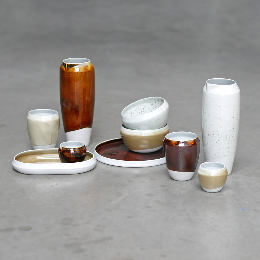 "Ignorance is Bliss" is a limited-edition hand-made homeware collections. By collecting samples of polluted soils, she then experimented with different techniques to transform waste products into ceramic pigments.  Each porcelain piece is hand-crafted and fired in a unique reduction gas oven. Surprisingly, the irregularities present in residue using pigments from waste lead to more vibrant design objects. Eco-design, responsible design, handmade ceramics.